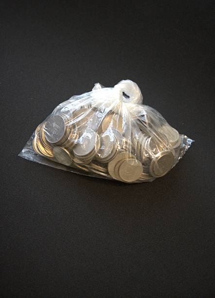 istock Hungarian forint coins inside a sealed transparent plastic bag on black background. Financial or economic concept 2227059461