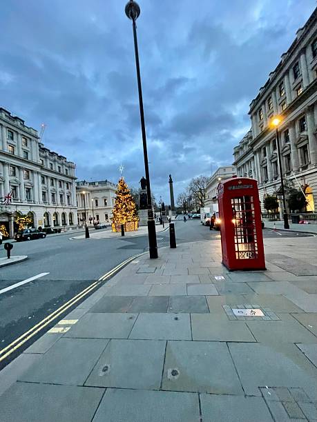 istock Red telephone box and Christmas Tree lights 2227059899