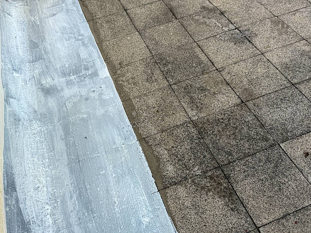 istock A grey and white tile floor with a grey and white paint line 2227061418