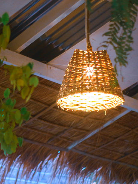 istock Handmade bamboo lamp for boho eco-style interior, warm natural ambiance. 2227072152