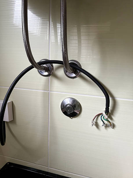 istock Water Heater Replacement in Progress – Exposed Plumbing and Electrical Wires 2227072347