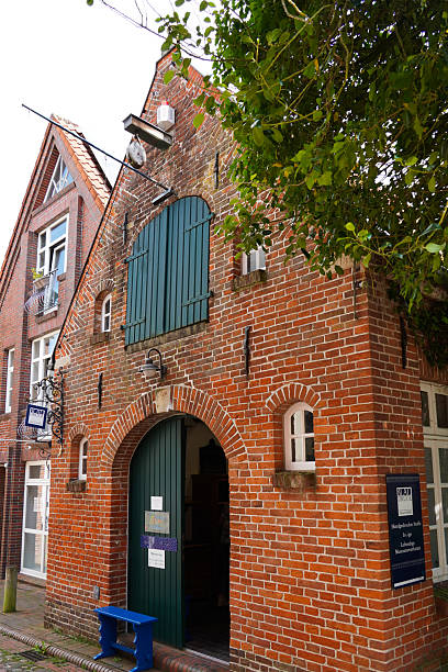 Jever, East Frisia, Germany. July 16, 2025. Historic town center of Jever, East Frisia. Front , entrance, of the old blueprint handcraft Building.