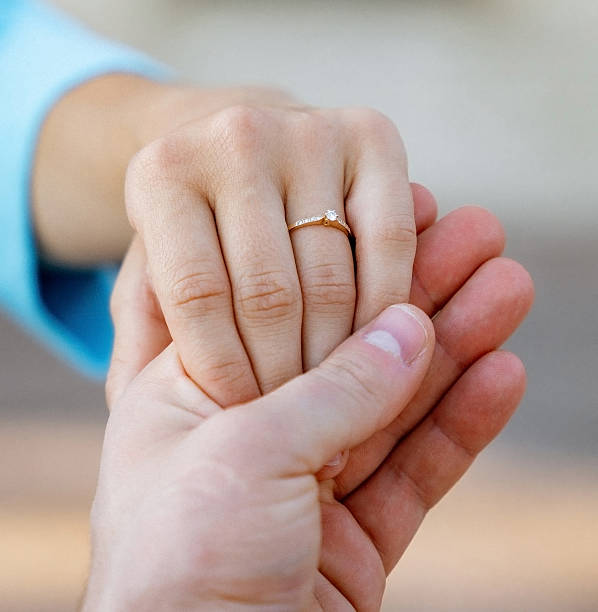 istock Hands of a freshly married couple 2227074920