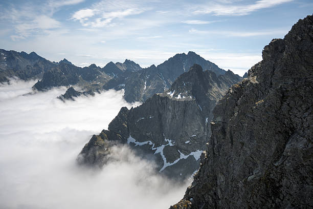 istock Mountain peaks surrounded by clouds, trekking in the mountains. 2227075073