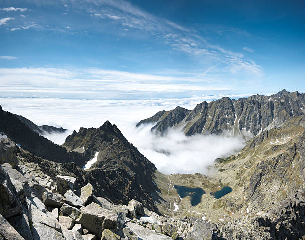 istock Clouds in the mountain valley, beautiful weather for climbing. 2227075130