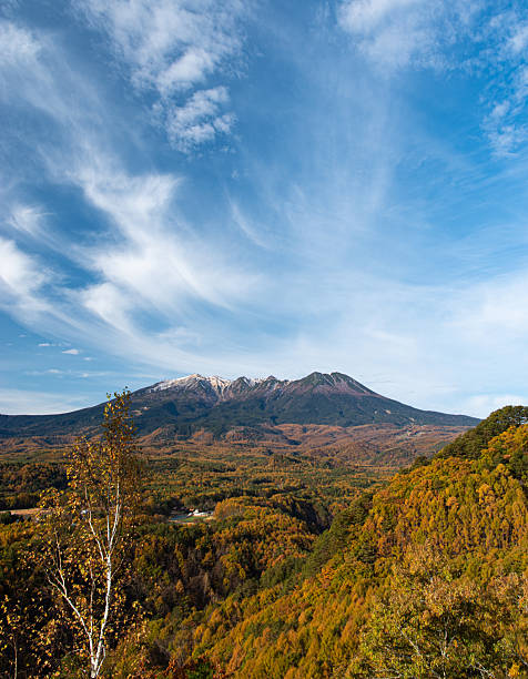 istock Autumnal forest and beautiful Mt. Ontake 2227082205