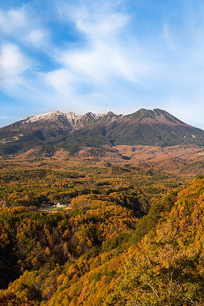 istock Autumnal forest and beautiful Mt. Ontake 2227082273