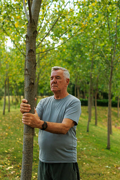 istock Senior Man Connecting with Nature in Forest 2227084459