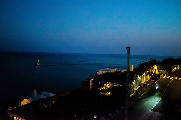 A stunning panoramic view of the Amalfi Coast with turquoise waters, dramatic cliffs, and colorful hillside villages.