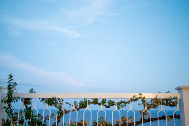 A stunning panoramic view of the Amalfi Coast with turquoise waters, dramatic cliffs, and colorful hillside villages.