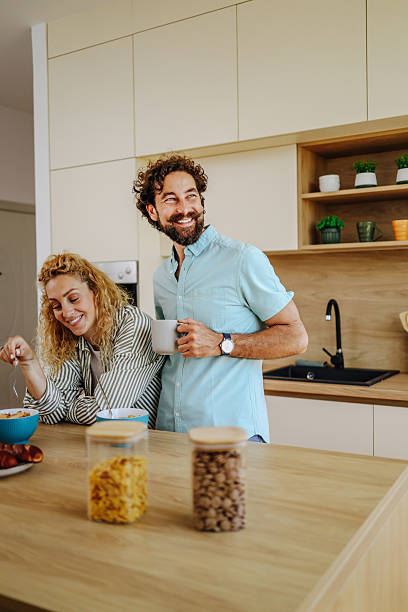 istock Happy couple enjoying breakfast in modern kitchen 2227087709