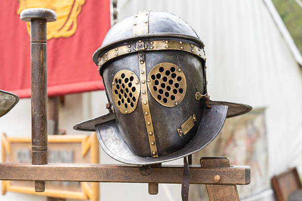 istock Ancient Roman gladiator helmet in a military camp 2227089828