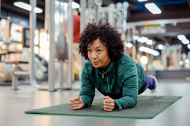 istock Mature Female Performing Plank Pose During Workout Session 2227091023