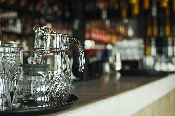 istock Glass Pitcher and Teapot Standing on Bar Counter in Restaurant Interior 2227091682