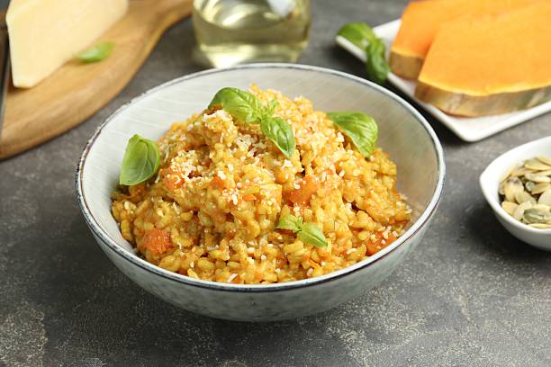 istock Delicious pumpkin risotto on grey table, closeup 2227093424