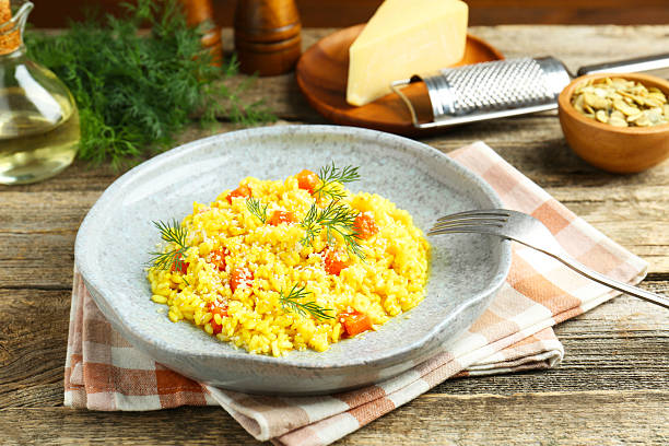 istock Delicious pumpkin risotto served on wooden table, closeup 2227093530