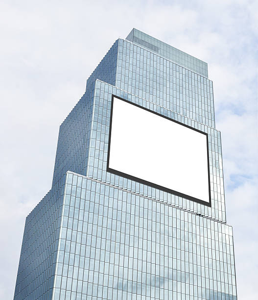 istock Mock up white horizontal large LED display billboard on tower building. Clipping path for mockup 2227095922