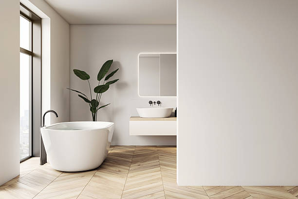 Modern luxury bathroom interior with freestanding bathtub, sink and large blank wall with copyspace for poster, logo or signage mockup template. 3D Rendering