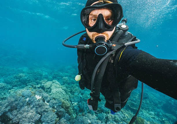 istock Scuba diver taking a selfie underwater exploring coral reef 2227099567