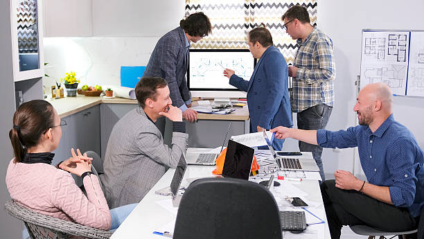 istock Colleagues from the architectural bureau are working together on a new construction project. A group of people gathered for a briefing 2227106526