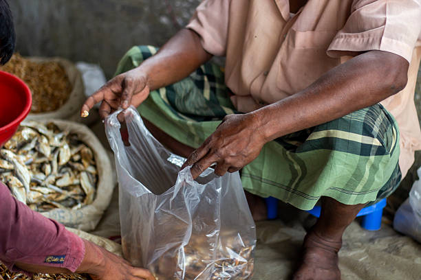 istock A man holds a plastic bag in the market 2227109492