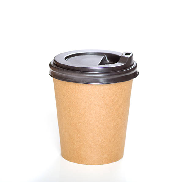 istock Brown paper cup with black plastic lid for hot drinks on white background. 2227112248