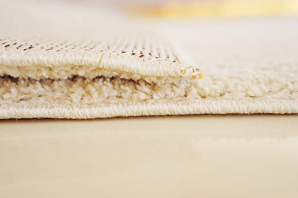 close-up. beige Interior pile carpet made of polypropylene. Long fibers form a high pile. pleasant lint texture, softness and hypoallergenicity.