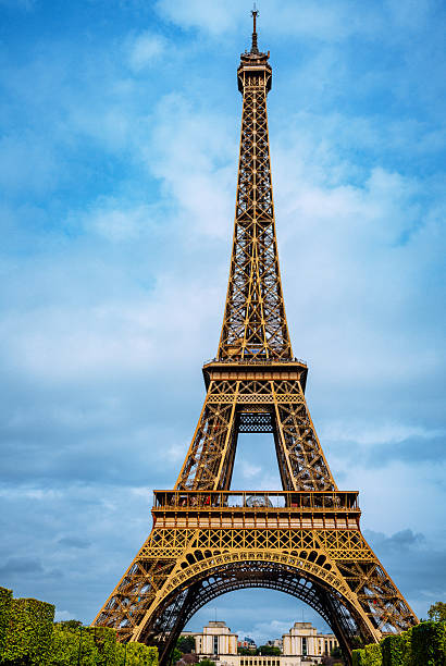 The stunning Eiffel Tower photographed on a clear day, showcasing this iconic structure amidst a vibrant blue sky in the heart of Paris.