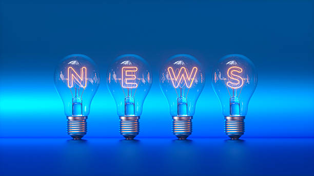 A row of classic lightbulbs stands against a vibrant blue background, their glowing orange filaments forming the word \