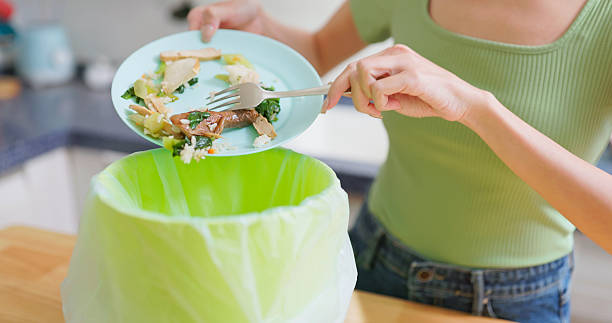 istock Asian Woman Food Waste kitchen 2227115881