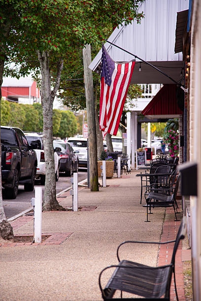 istock U.S. Flag on a Sidewalk in Smalltown USA 2227117479