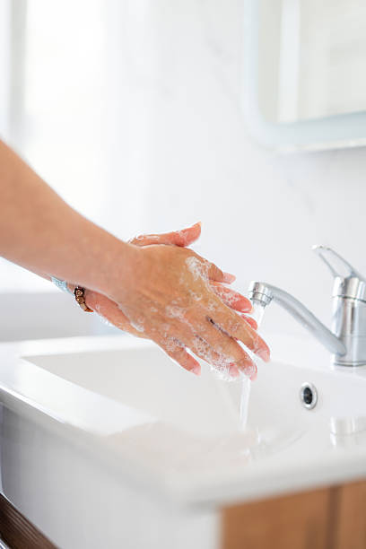 istock Woman Washing Hands 2227117988