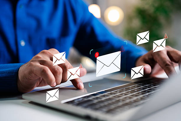istock A Businessman working on a laptop open an email with triangle caution warning sign for notification error and maintenance concept, network security, computer virus detected, personal data protection. 2227118721