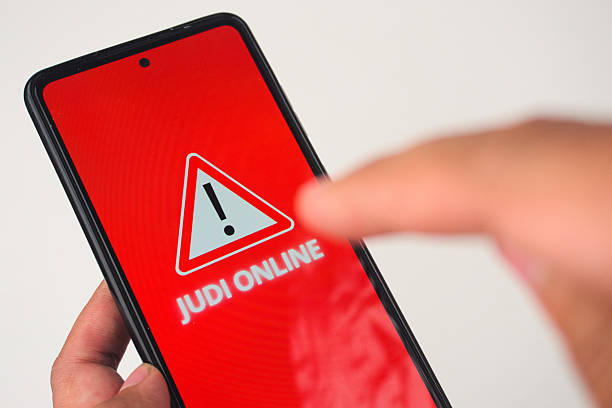 istock Online Gambling Warning on Smartphone Screen 2227118891
