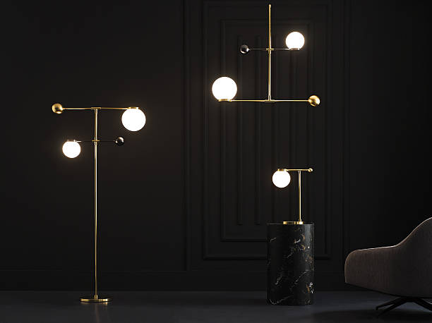istock Modern gold floor lamp with frosted globe in dark interior 2227119308