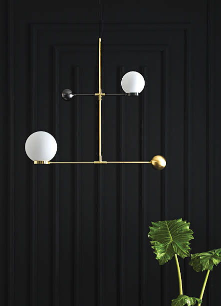 istock Modern gold floor lamp with frosted globe in dark interior 2227119311