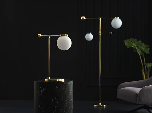 Modern gold floor lamp with frosted globe in dark interior