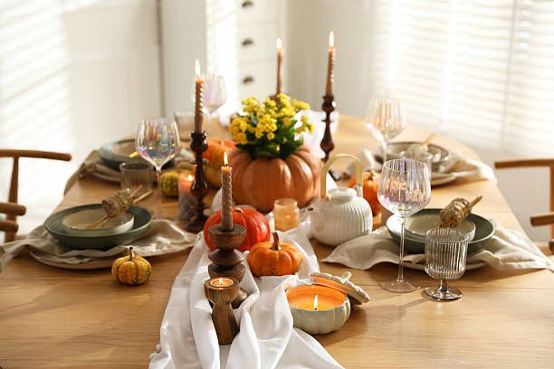 istock Stylish table setting with beautiful dishware, glasses and autumn decor in dining room 2227120631