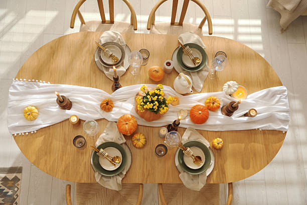 istock Stylish table setting with beautiful dishware, glasses and autumn decor in dining room, top view 2227120638
