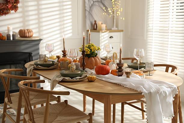 istock Stylish dining room with beautiful table setting and autumn decor 2227120655