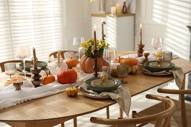 istock Stylish table setting with beautiful dishware, glasses and autumn decor in dining room 2227120658
