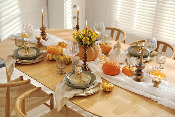 istock Stylish table setting with beautiful dishware, glasses and autumn decor in dining room 2227120695