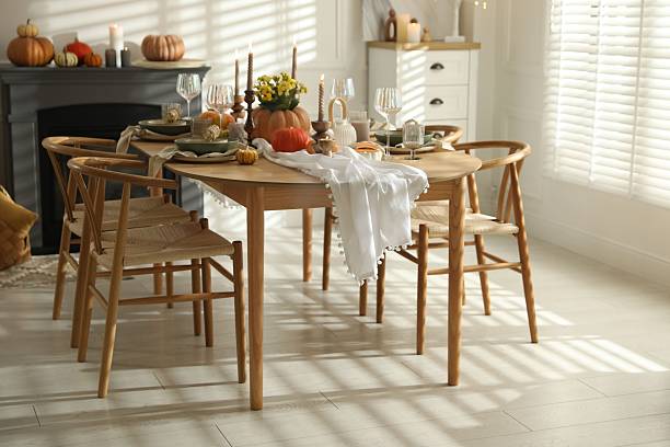 istock Stylish dining room with beautiful table setting and autumn decor 2227120702