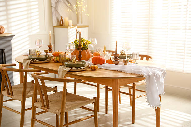 istock Stylish dining room with beautiful table setting and autumn decor 2227120713