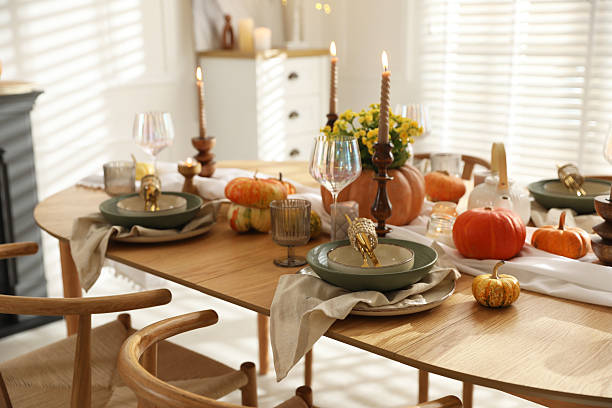 istock Stylish table setting with beautiful dishware, glasses and autumn decor in dining room 2227120717