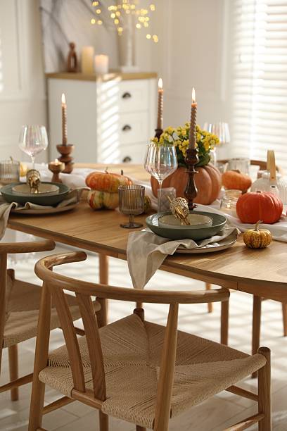 istock Stylish table setting with beautiful dishware, glasses and autumn decor in dining room 2227120722