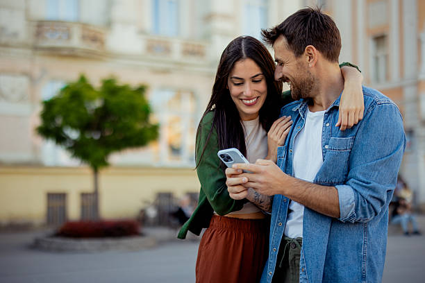 istock Stylish Couple Exploring City with Smartphone 2227120868
