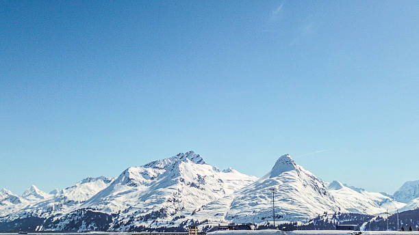 The mountains of Alaska rise above the tree line. A stunning site to see on this bright day in Fall. Many mountains such as these can be seen when traveling through interior Alaska The road is long however, travelers will be amazed at the scenic views along the way.