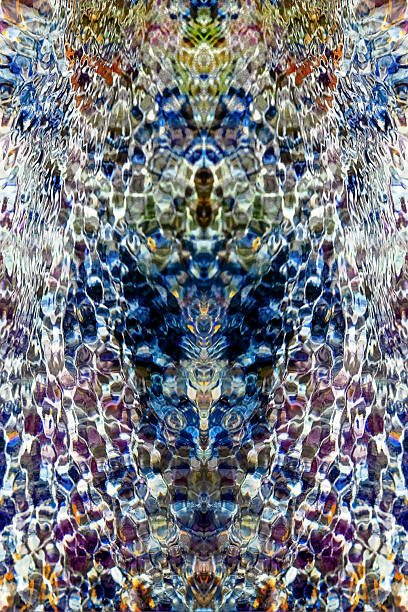 istock Bright blue and purple abstract design obtained from symmetrical vertical reflection of glare of flowing water in a stream 2227122821