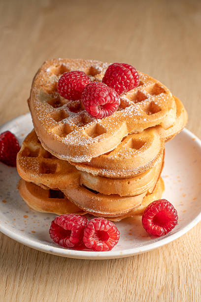 istock Heart-shaped waffles with raspberries from above 2227124325